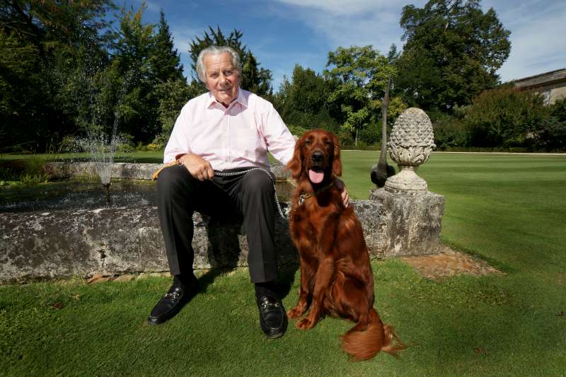 Anthony Barton sits with Doune in front of the water garden at Château Langoa Barton. His dog depicts the youthful exuberance with which Anthony still makes his wine although 80 this year. The colour saturation of the image reflects the richness and power of the wine of Château Léoville Barton.